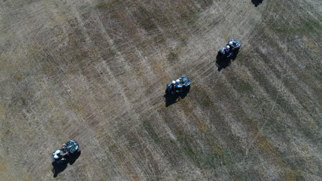 Aerial-vertical-view-of-a-group-of-ATV-riders-(quad-vehicles).-Sunny-day-France.